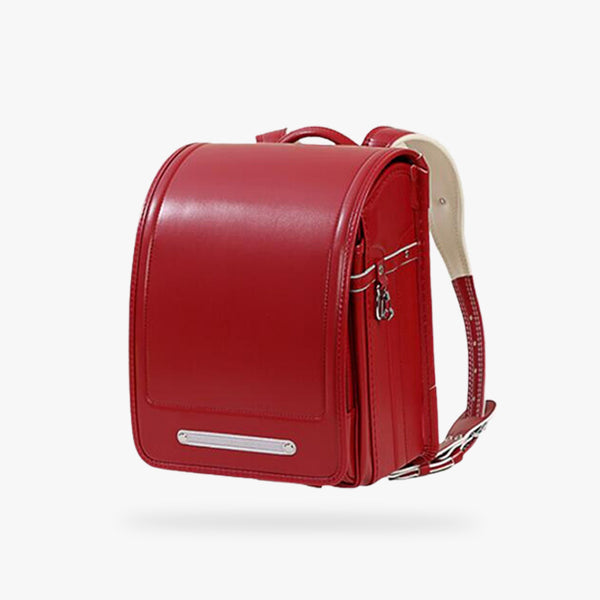 Ce sac a dos japonais randoseru est de couleur rouge avec des bretelles. C'est un sac japonais traditionnel en cuir