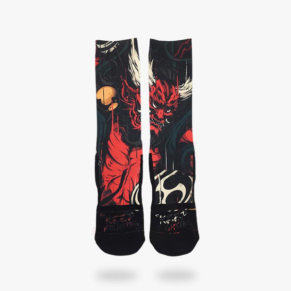La chaussette dessin japonais est imprimé avec un dieu japonais. C'est le kami raijin. Deux chaussettes japonais de couleur rouge et en coton