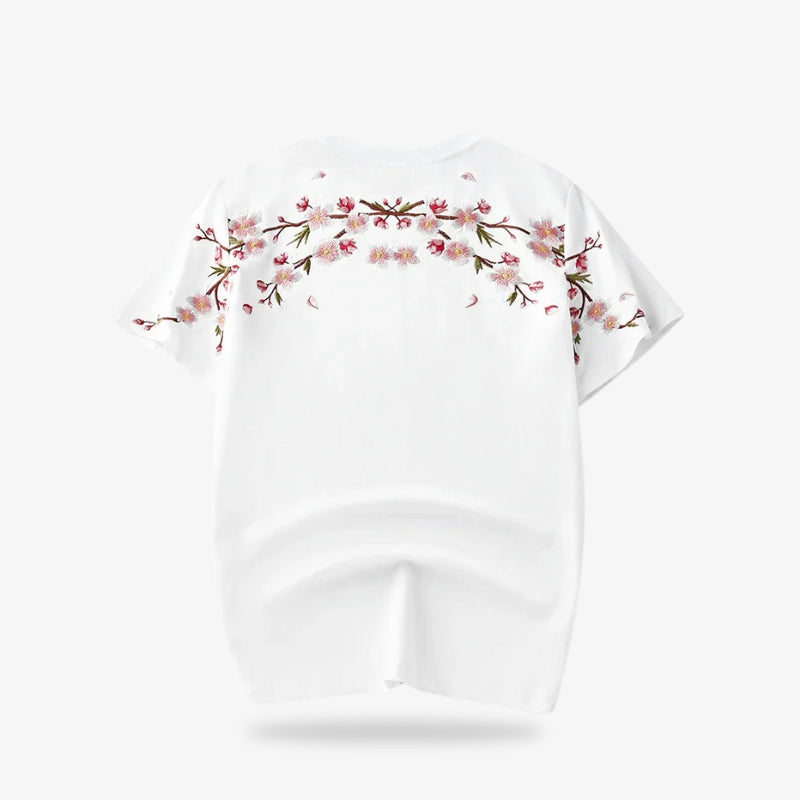Chemise blanche brodée fleurs de cerisier posée à plat
