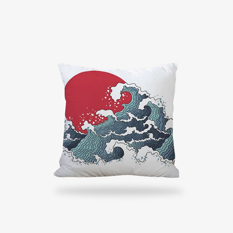Une housse de coussin japonais avec un dessin d'art. Les symboles imprimés sur la housse blanche sont le disque rouge du drapeau japonais et une inspiration de la grande vague de Kanagawa d'hokusai