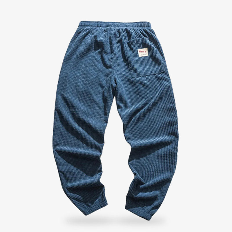 Pantalon en velours côtelé bleu marine pour femme, mêlant tissu classique et coupes inspirées du Japon