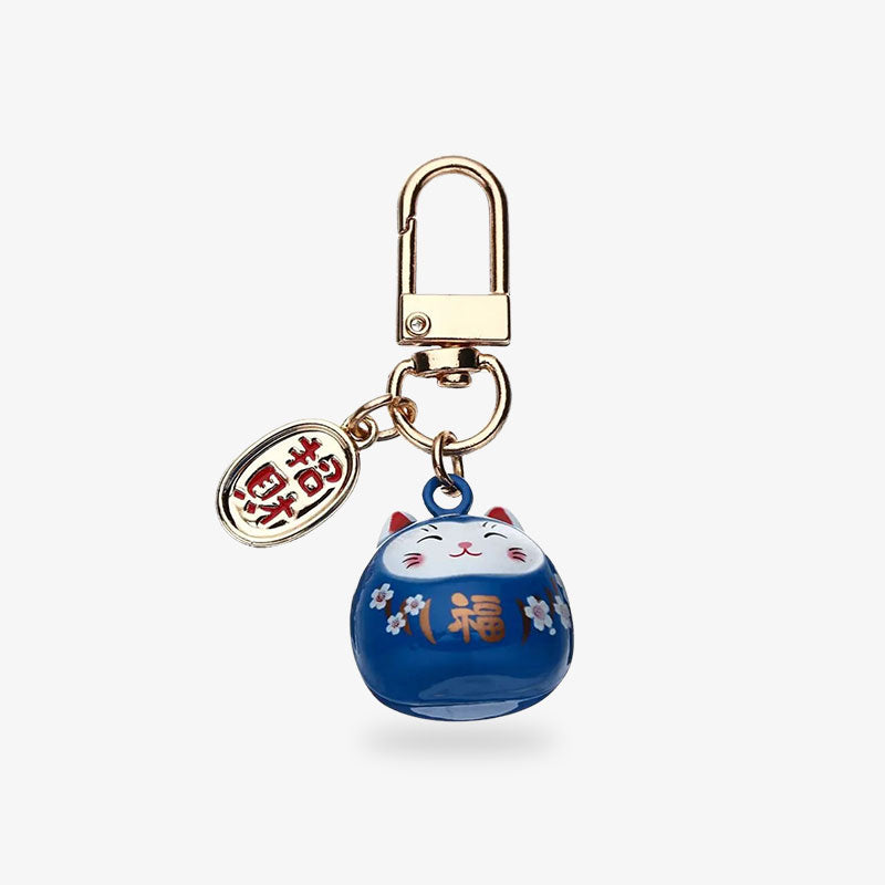 Ce porte-clé maneki neko cultura est de couleur bleu nuit avec un piecette gravé d'un kanji japonais