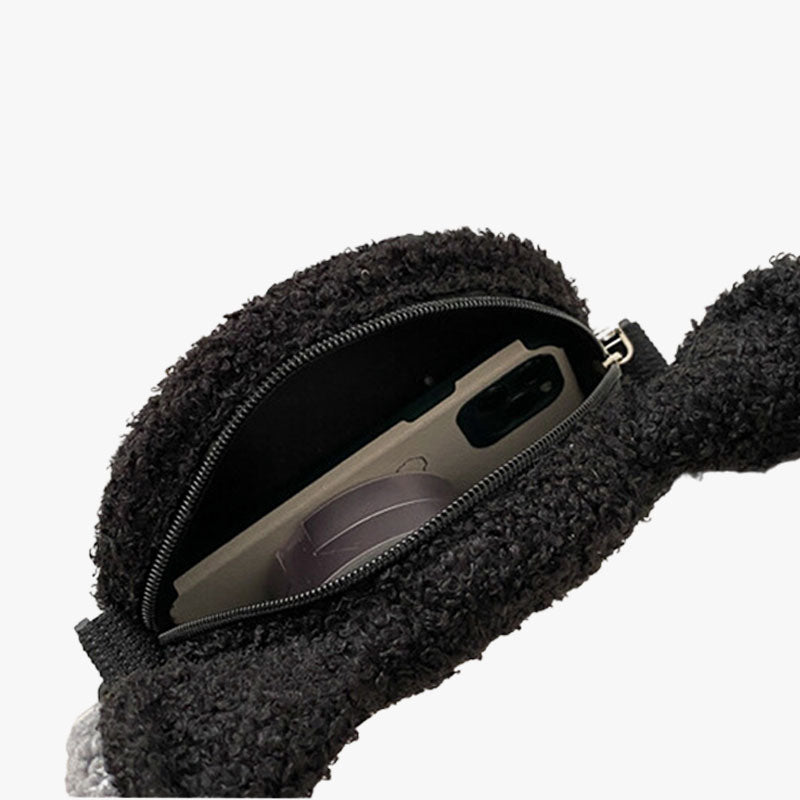 Un sac kawaii molteonne noir avec une ouverture en zip