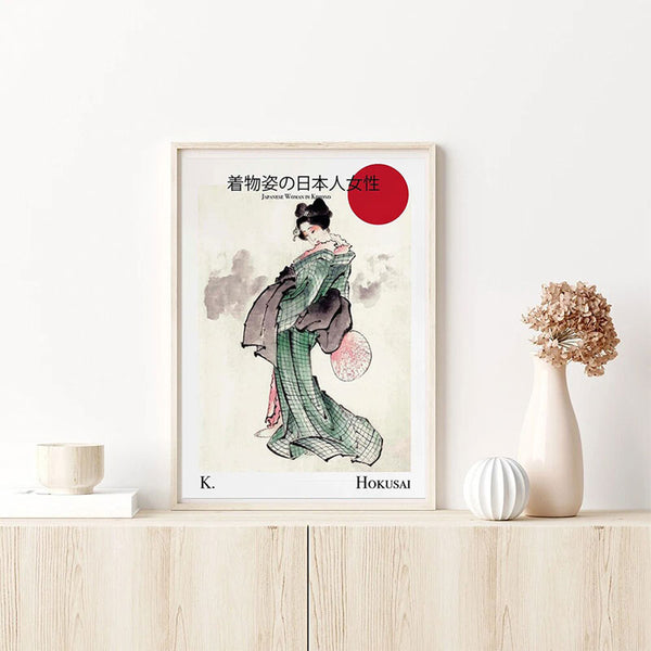 Ce tableau geisha moderne est une reproduction d'hokusai. Cet objet de décoration japonaise est positionné sur un meuble en bois