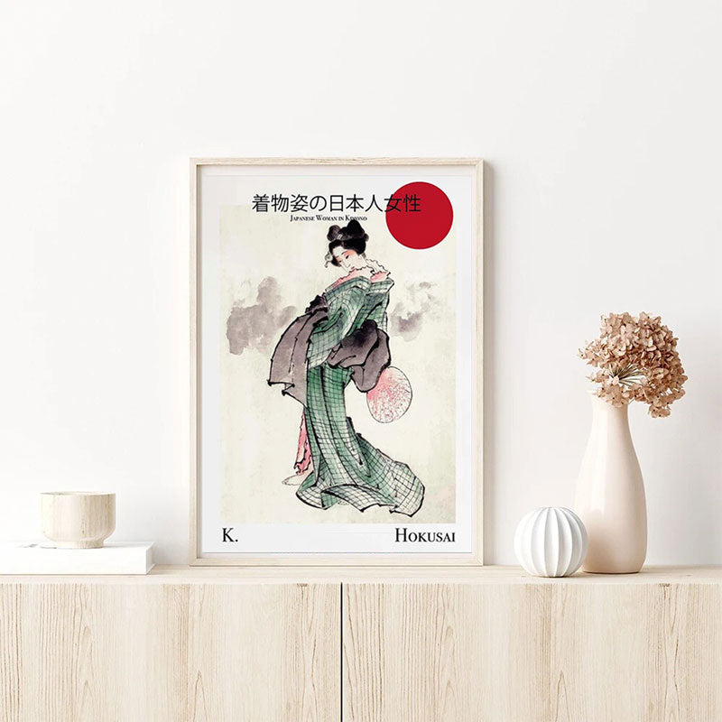 Ce tableau geisha moderne est une reproduction d'hokusai. Cet objet de décoration japonaise est positionné sur un meuble en bois