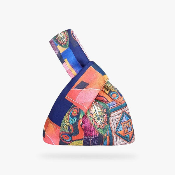 Ce sac a noeud japonais est un sac fourre tout avec des imprimés de couleurs vives sur le coton