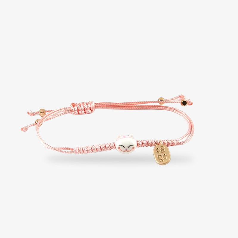 Ce bracelet chat maneki neko est un bracelet japonais de couleur clair.  La tête du maneki neko cat est en céramique