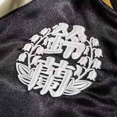 Broderie kanji blanche sur veste sukajan noire