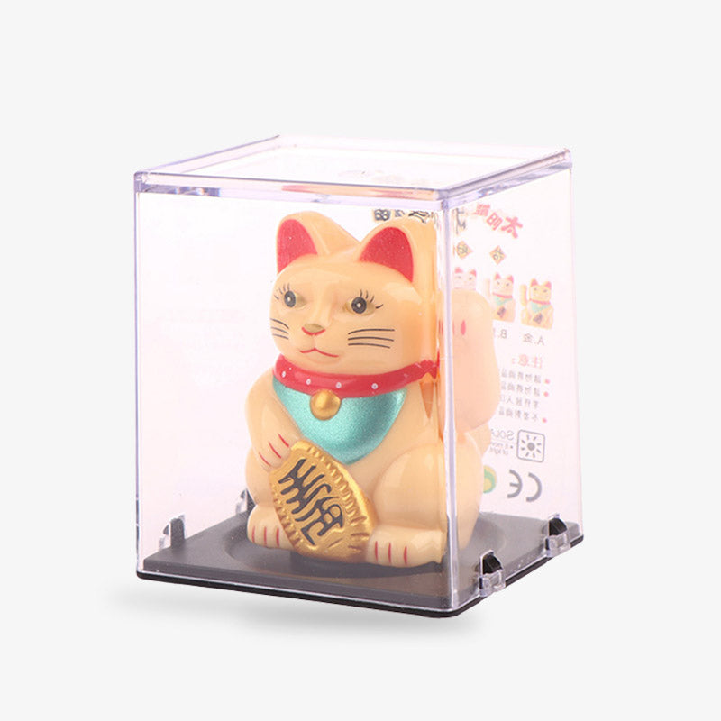 Ce chat maneki neko traditionnel est de couleur or. Il tient dans la main une pièce Koban et leve sa patte gauche qui bouche pour attirer la chance, l'argent et la fortune