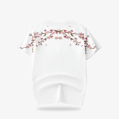 Chemise blanche brodée fleurs de cerisier posée à plat