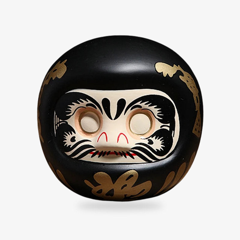 Daruma noir, porte-bonheur japonais symbole de protection et de détermination, idéal pour fixer et atteindre ses objectifs
