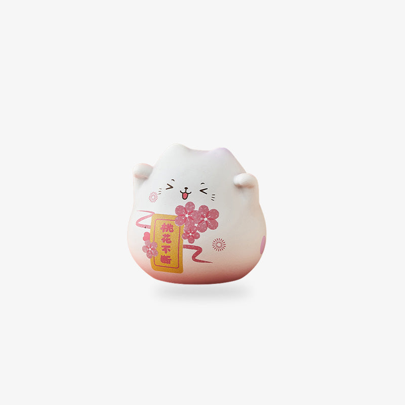 Une mignonne figurine chat kawaii avec un motif de fleur de sakura