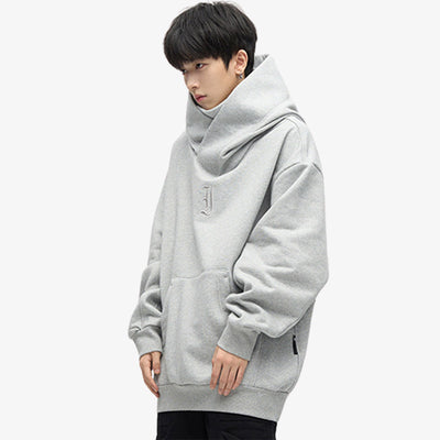 Hoodie oversize Japon en coton gris, alliant minimalisme et confort, parfait pour un style décontracté inspiré du streetwear japonais.