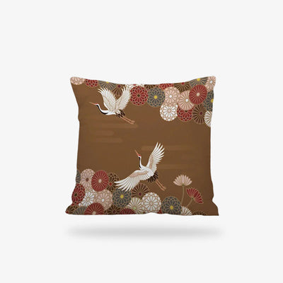 Une coussin-japonais rouge avec des motifs traditionnels de grues Tsuru et des symboles de fleurs de sakura