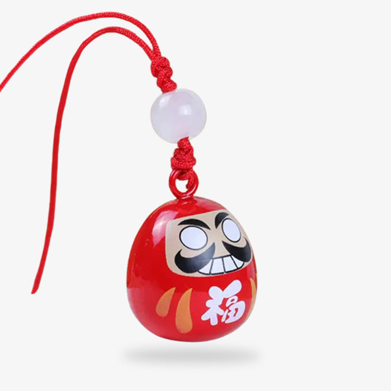 Porte-clés Daruma à acheter, un porte-bonheur japonais traditionnel représentant la persévérance et la poursuite de ses ambitions