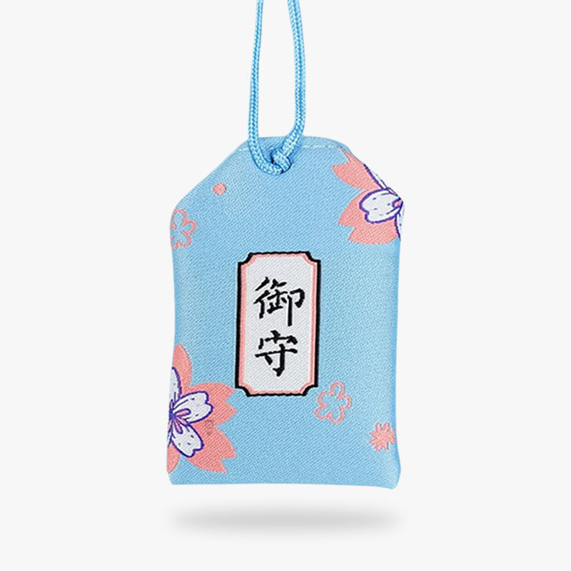 Le Shiawase Omamori japonais est une amulette en tissu pour apporter le bonheur. Le tissu du talisman est imprimé avec des fleurs de cerisiers et un kanji symbolique