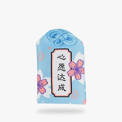 Le Shiawase Omamori est un porte-bonheur japonais avec des fleurs de sakura et un kanji. C'est un petit sac japonais dans lequel on met une prière en hommage aux dieux