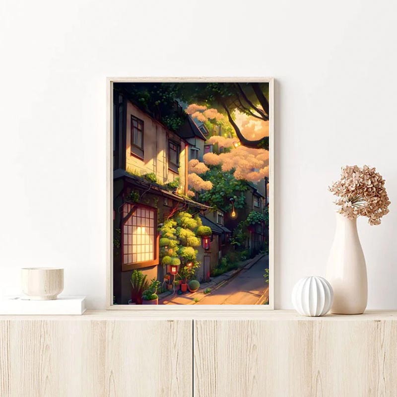 Ce tableau japonais kyoto est dans un cadre en bois posé sur une commode en bois clair