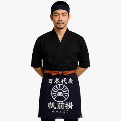 Tablier maekake japonais en coton marine orné de kanji blancs, idéal pour la cuisine traditionnelle