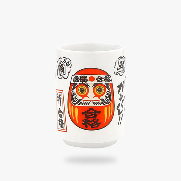 Une tasse style japonais avec un symbole de statuette Daruma