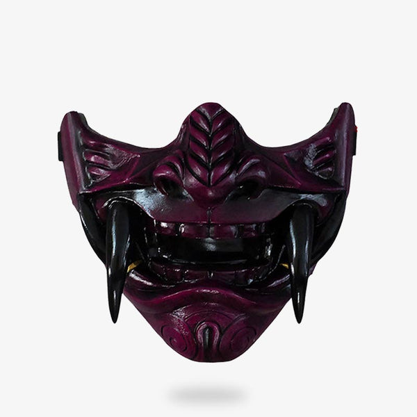 Ce masque traditionnel japonais s'inspire du demi-visage du démon Oni avec des crocs et des dents terrifiantes