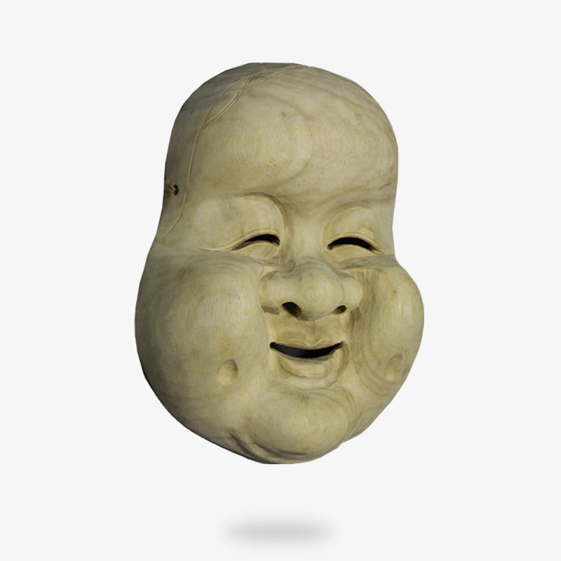 Ce masque du Japon est en bois. C'est un visage de femme qui sourit